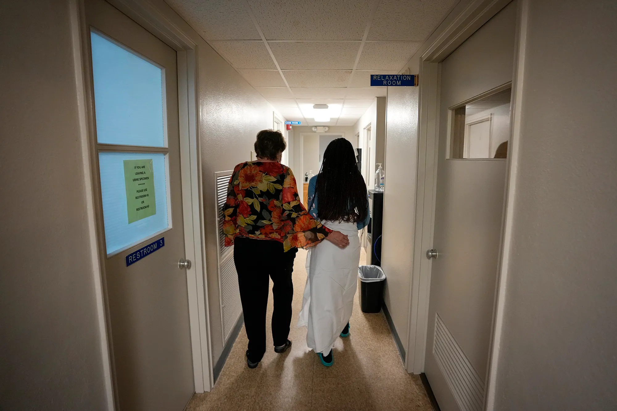 A patient from central Texas is escorted down the hall by clinic administrator Kathaleen Pittman prior to getting an abortion at Hope Medical Group for Women in Shreveport, Louisiana on Oct. 9, 2021.