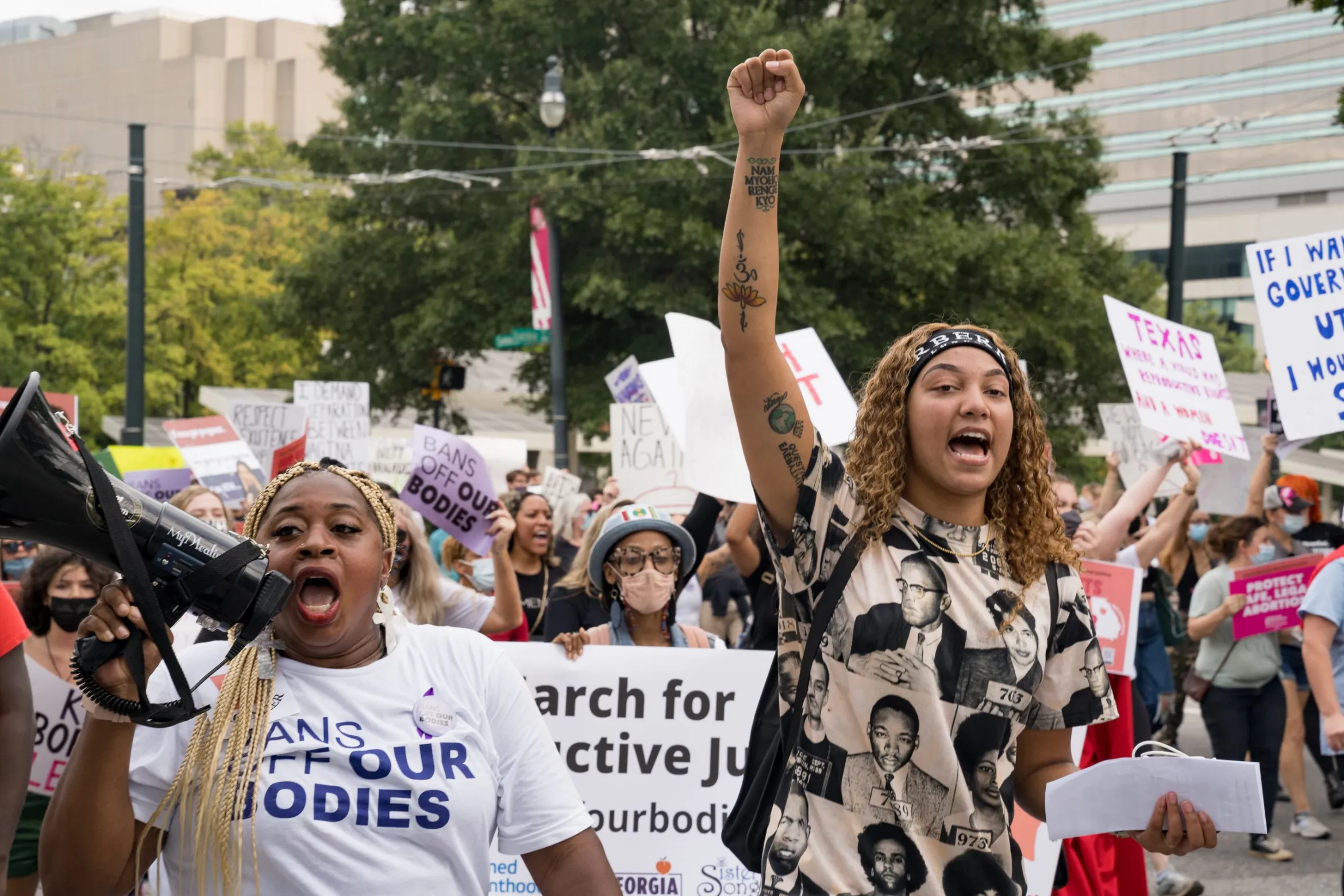 Porchse Queen Miller (L) leads a group of demonstrators in support of women's reproductive rights on Oct. 2, 2021, in Atlanta. The Women's March and other groups organized marches across the country to protest the new abortion law in Texas.